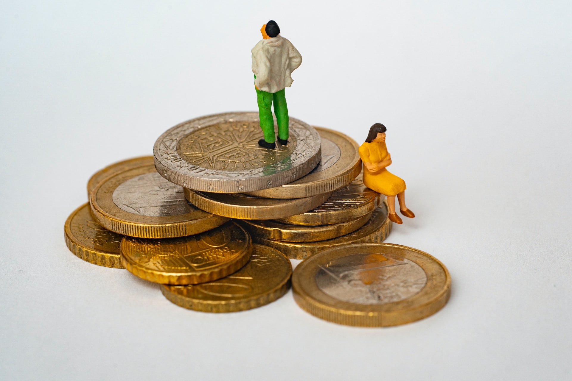 Small figurine standing on coins
