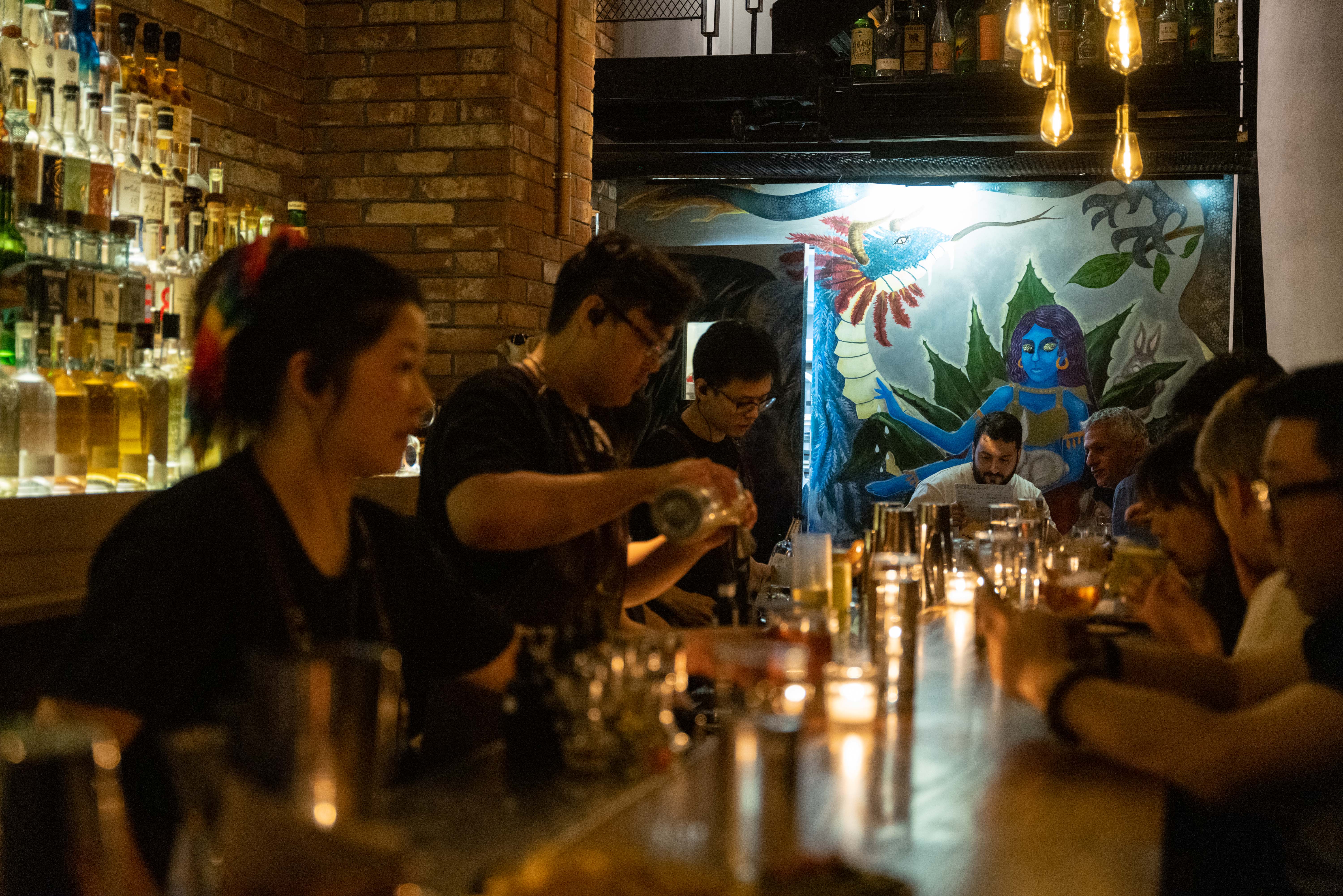 A dimly lit bar somewhere in east Asia.
