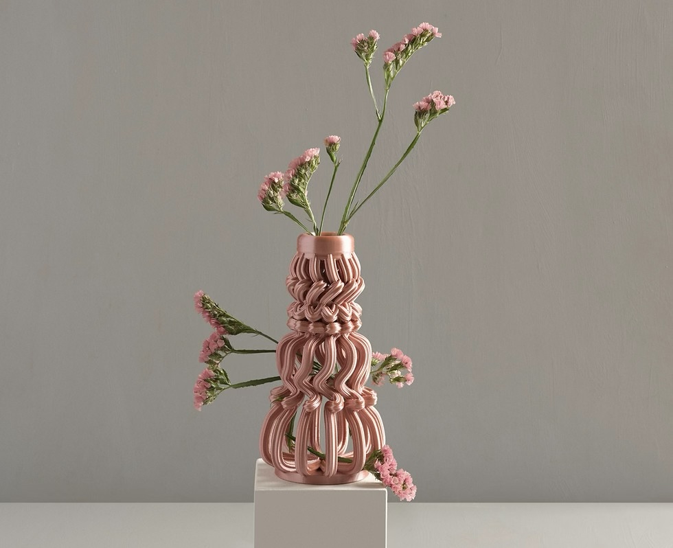 A 3D printed vase with distinctive ridges.