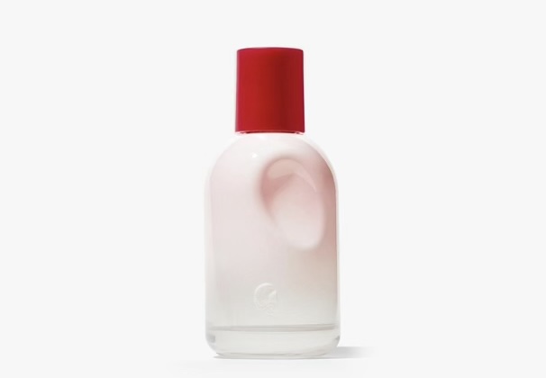 Glossier bottle with distinctive thumb-shaped imprint on the side.