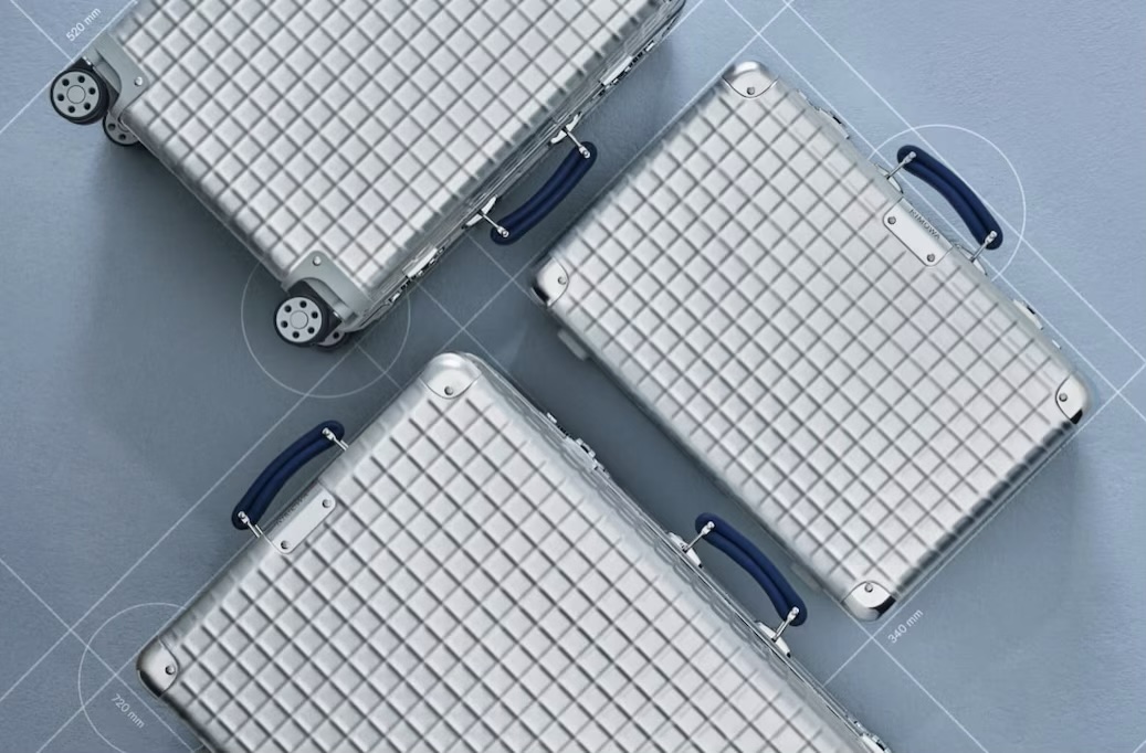 RIMOWA aluminium suitcases with distinctive cross-hatched patterns.